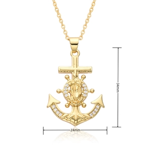 Macro detail of religious anchor cross pendant with 18k gold plating and zircon inlay