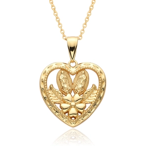 Macro shot of 18k gold plated hollow heart pendant with Virgin Mary religious relief details