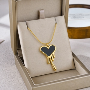 Lava drip heart pendant necklace in gold-tone titanium steel with black oil finish