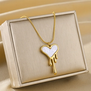 Elegant gold-plated stainless steel necklace with melting heart pendant and white enamel detail
