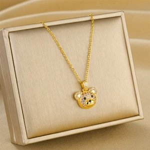 Luxuriöse goldene Halskette mit Teddybär-Anhänger und funkelnden rosa und schwarzen Zirkonia