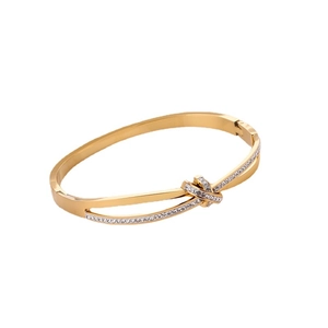 Polished gold knot bangle in stainless steel with sparkling micro-inlaid rhinestones