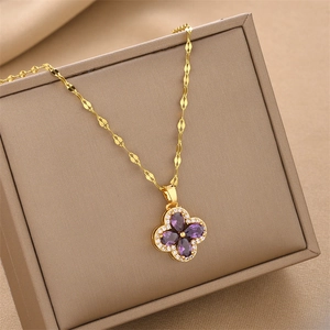 Gold stainless steel necklace with purple zircon clover pendant and pave crystal details