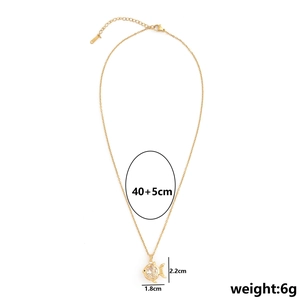 Gold small fish pendant necklace with sparkling zircons and adjustable chain length