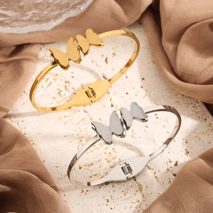 Minimalist double butterfly open bangles in gold and silver finish with matte texture