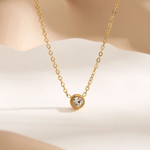 Minimalist 18K gold-plated titanium necklace with a single round solitaire pendant