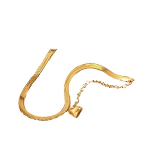 Gold herringbone chain necklace with 3D heart pendant in minimalist steel finish
