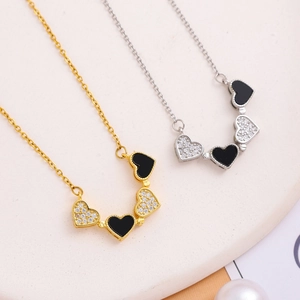 Gold and silver four-leaf clover necklaces with black enamel and zircons for women