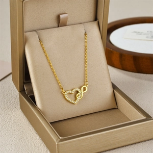Gold infinity heart necklace for women with micro-paved cubic zirconia accents