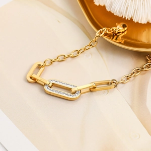Elegant gold stainless steel O-chain anklet featuring a double-oval crystal pave centerpiece