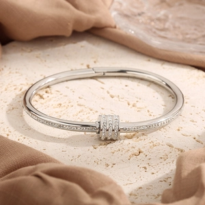 Luxurious silver-tone bracelet with crystal-studded cylinder and micro-pave detailing