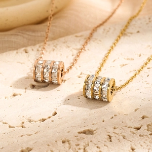 Titanium steel necklace with three-ring cylinder pendants in rose gold and gold finishes