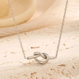 Minimalist silver knot necklace in vintage modern style with polished titanium steel finish