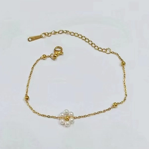 Detailed view of handmade beaded flower necklace with gold chain and lobster clasp