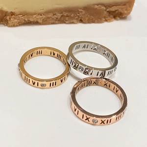 Three-piece stackable roman numeral rings in gold silver and rose gold with zircon stones