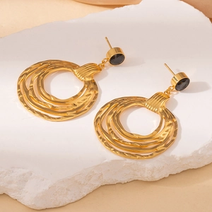 Vintage gold layered hoop earrings with hammered texture and black stone on stone base