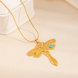 Golden dragonfly pendant necklace with green turquoise on a sleek snake chain