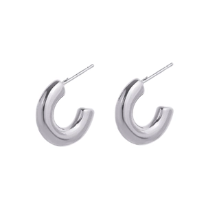 Detailed close-up of C-shaped chunky earrings with polished silver stainless steel finish
