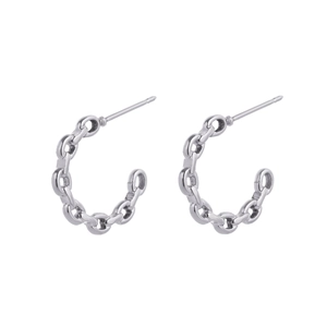 Detailed view of silver chain-link C-shaped earrings in polished stainless steel