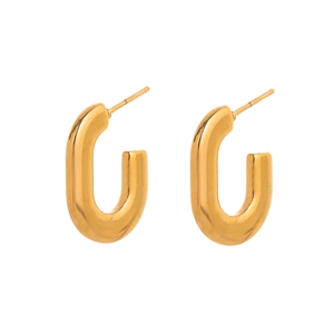 Macro detail of U-shaped gold earrings with polished metallic finish and stud closure