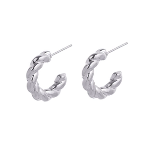 Close-up of silver twist texture hoop earrings with polished metal finish