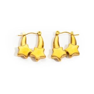 Macro shot of 18K gold plated stainless steel double star hoop earrings with metallic glow