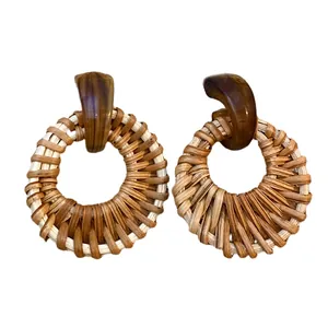 Bohemian rattan hoop earrings with dark brown resin stud in a minimalist aesthetic