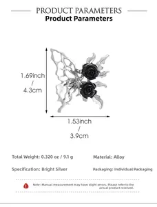 Macro detail of silver liquid metal butterfly brooch with black roses and 4.3cm size