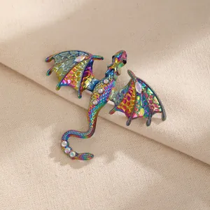 Close-up of a colorful iridescent flying dragon pendant featuring crystal rhinestones