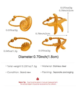 Detail view of 18K gold plated stainless steel starfish and seashell open rings set
