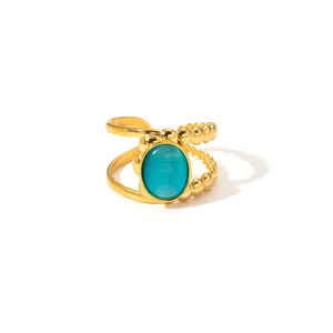 Asymmetric gold stainless steel ring with turquoise stone and beaded open design