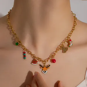 Golden Christmas necklace with elk, Santa hat, and bell charms on a festive chain