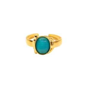 Vintage gold open ring with large oval blue-green cat eye stone and textured band