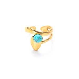 Adjustable gold wave ring with turquoise stone inlay on a clean white background