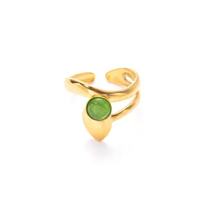 Detail of adjustable gold ring with double-band structure and green cat-eye gemstone