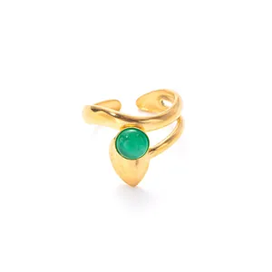 Detailed macro view of vintage gold open ring with a round green cat eye stone