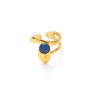 Macro detail of wave gold ring with blue opal stone and adjustable open band design