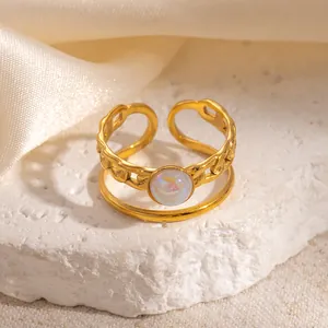 Detail of 18k gold-plated double-layer ring featuring chain texture and iridescent opal