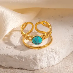 Detailed close-up of 18k gold plated double-layer ring featuring a green turquoise stone
