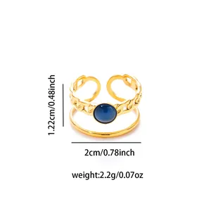 Detail view of gold titanium adjustable ring with blue stone and cuban chain texture