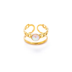 Detail of 18k gold plated adjustable ring with double layer chain and opal stone