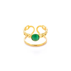 Detail of 18k gold plated stainless steel ring with Cuban chain design and green stone