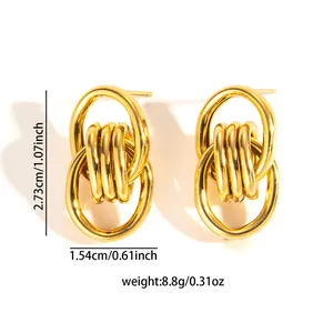 Macro shot of gold-plated 18k earrings with twisted texture and dimensions 2.7x1.5cm