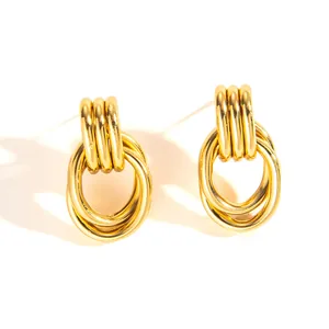 Detailed close-up of heavy-duty 18k gold plated twisted hoop earrings with polished finish