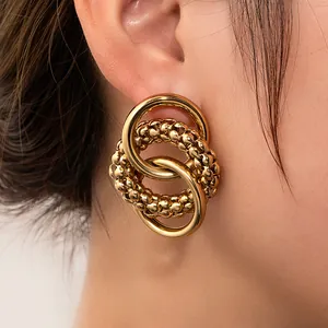 Retro hohle kreisförmig verschlungene Ohrstecker aus goldenem Titanstahl für Damen