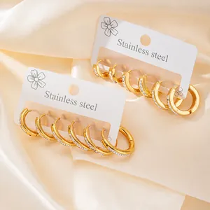 Detailed set of gold-plated stainless steel hoop earrings with sparkling cubic zirconia