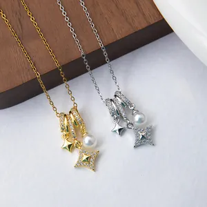 Detail view of gold and silver necklaces with pearl and zircon star pendants