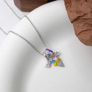 Detailed shot of ice cream and pink heart pendants on a luxury stainless steel chain