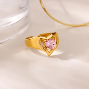 Elegant gold-tone heart ring with pink zircon gemstone in a romantic luxury setting