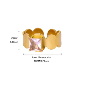 Detail of a gold-plated flower ring with a pink zircon square stone and size markings